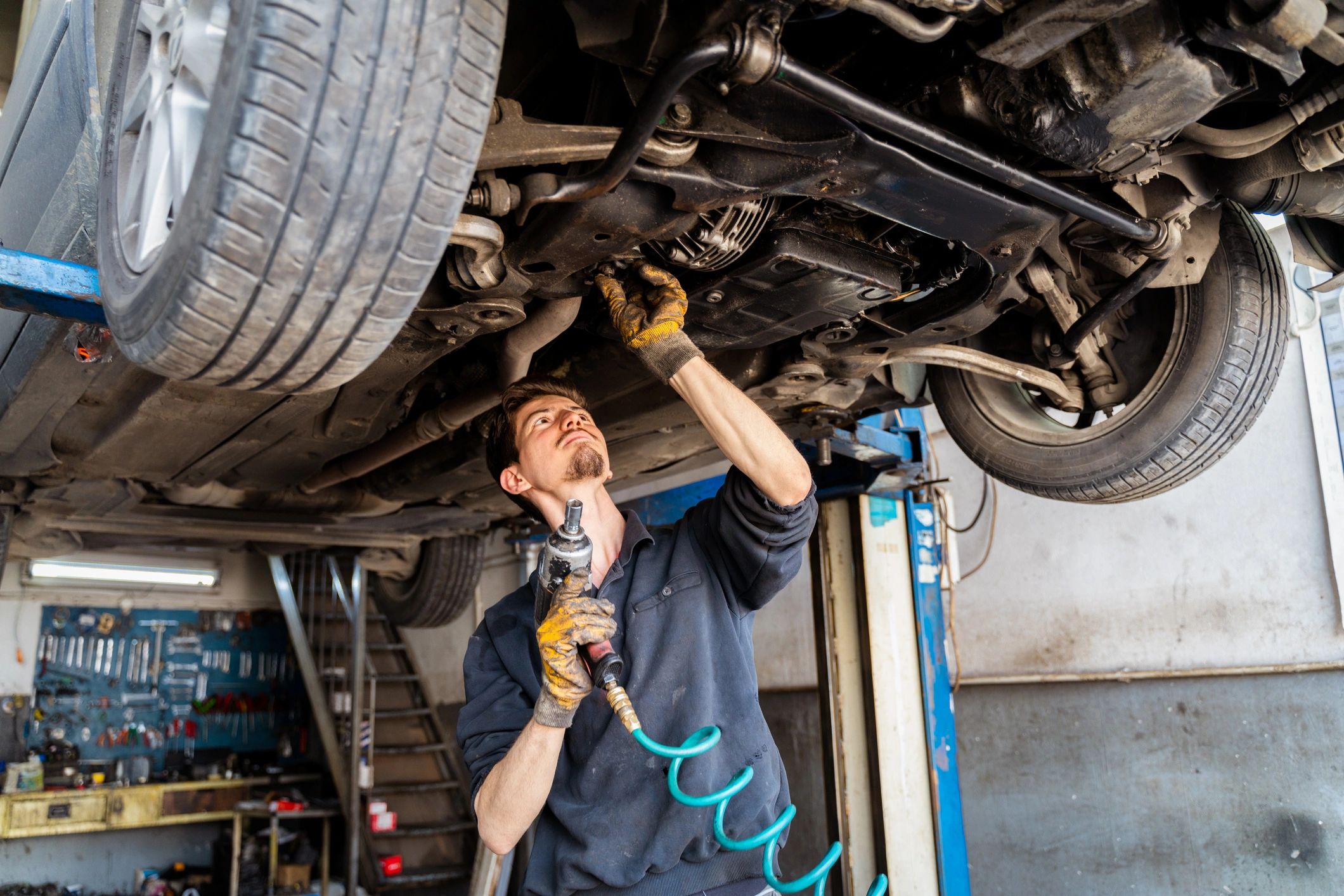 ASE-certified mechanic working in a clean Japanese auto repair bay