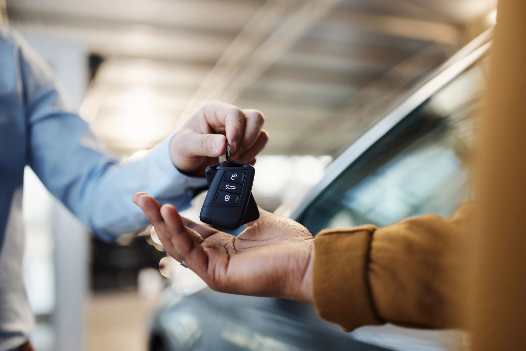 Customer receiving car keys at a service counter